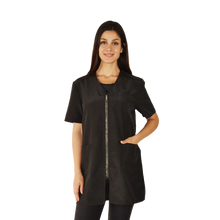 Load image into Gallery viewer, Woman wearing a black zip-up shirt on a white background

Pet groomer jacket
Water resistant grooming jacket

Hair repellent jacket
Bleach resistant jacket
Chemical proof jacket
Zippered pocket jacket
Durable grooming apparel
Professional grooming smock
Ladybird Line apparel
Grooming uniforms NZ