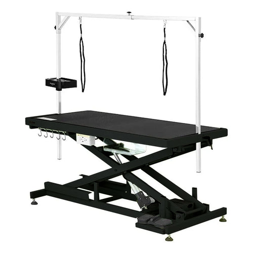 Shernbao Low-Low Electric Lift Grooming Table in black with built-in USB/power outlets, a clear storage drawer, and metal hanging hooks. The table is designed for low ground level and has an adjustable height mechanism.